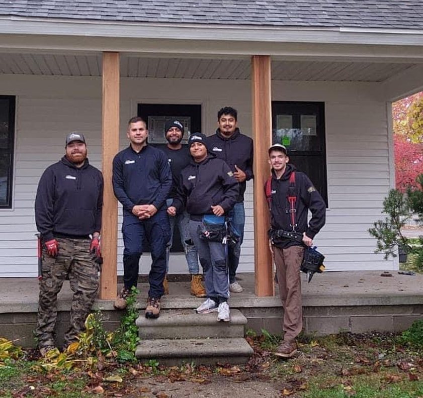 The HomePro Services crew on the porch of a finished home