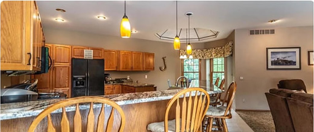 Kitchen before: oak cabinets and a closed layout