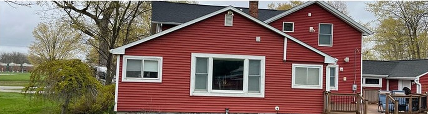 Home before: faded red siding