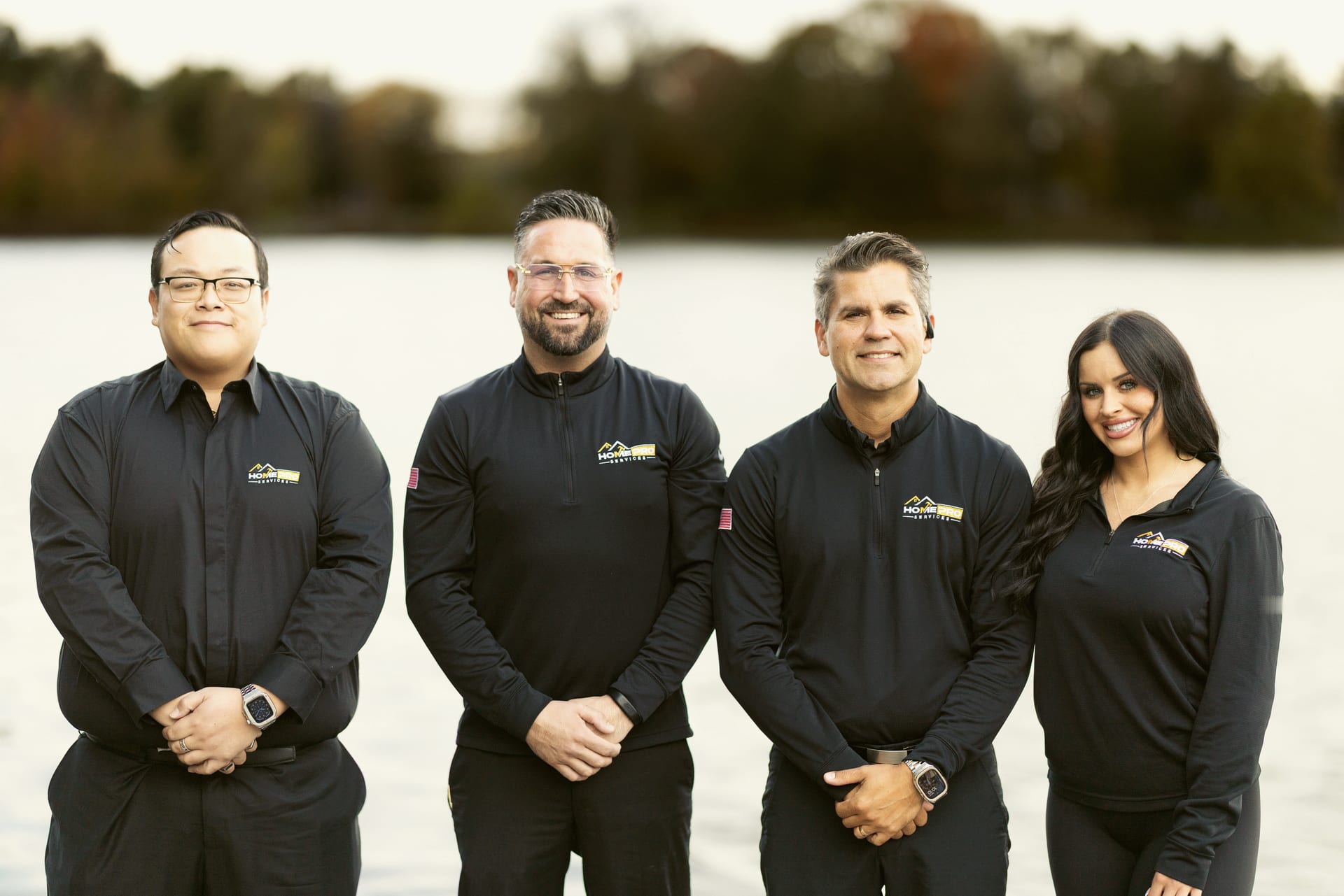 The HomePro crew: Tayler, Lourenzo and the team on a dock at a Michigan lake