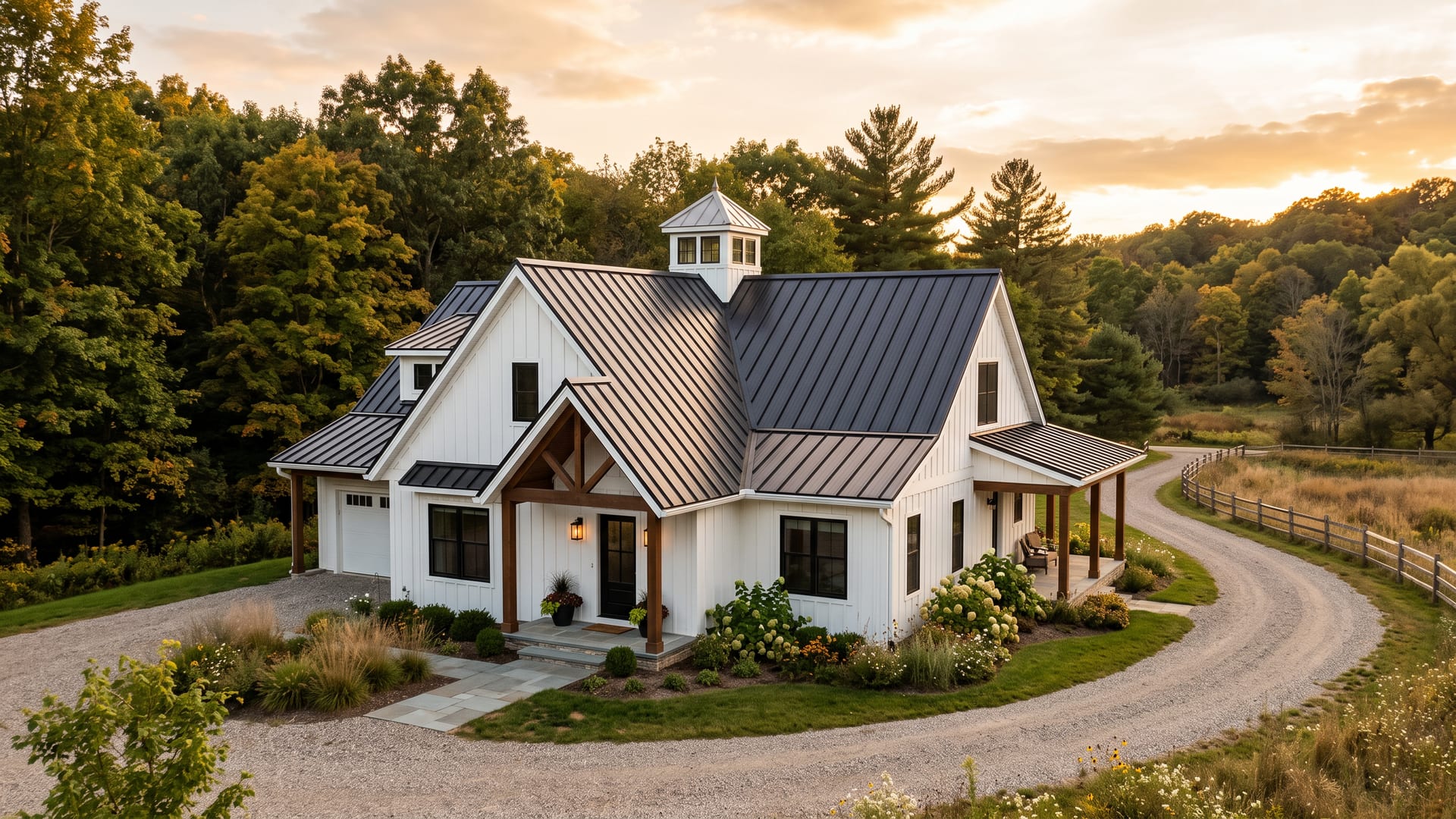 A modern farmhouse with a new charcoal standing-seam metal roof and a cupola